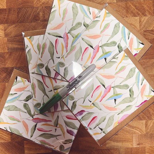 Greeting card featuring illustrated rainbow gum leaves