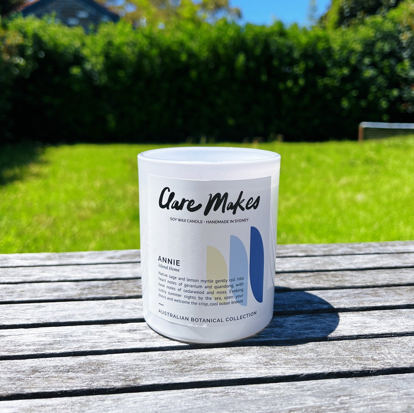 Annie Island Home candle by Clare Makes styled outdoors with summer coastal vibes