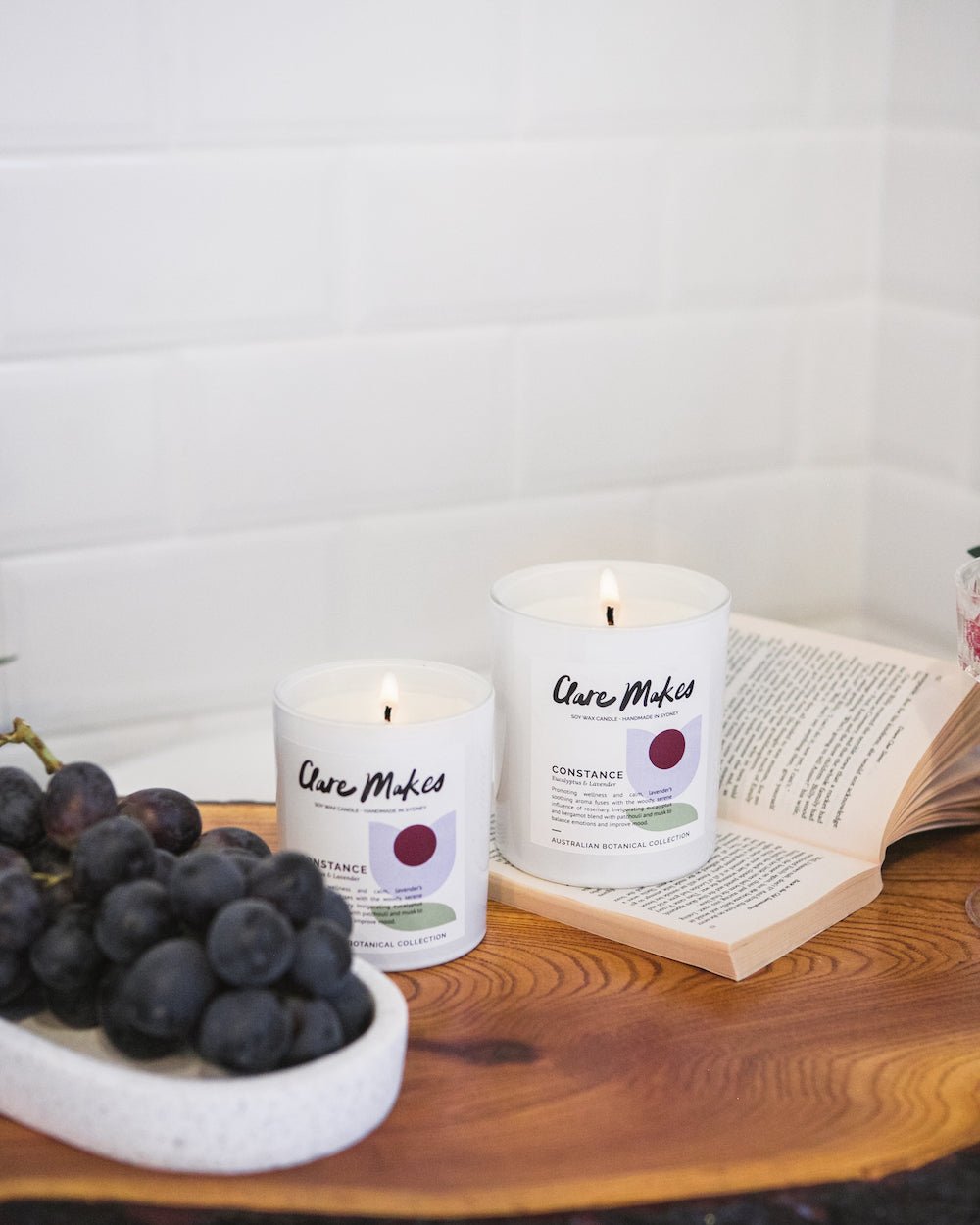 Styled image of Constance: Eucalyptus & Lavender candle on timber with soft light