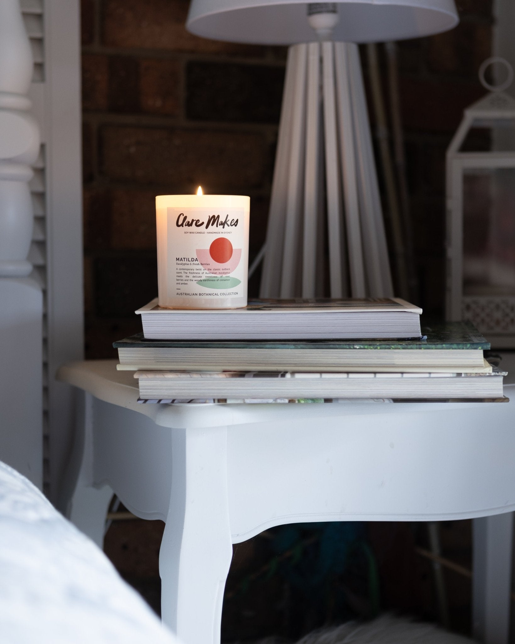 The Clare Makes Matilda candle displayed at home, on a bedside table