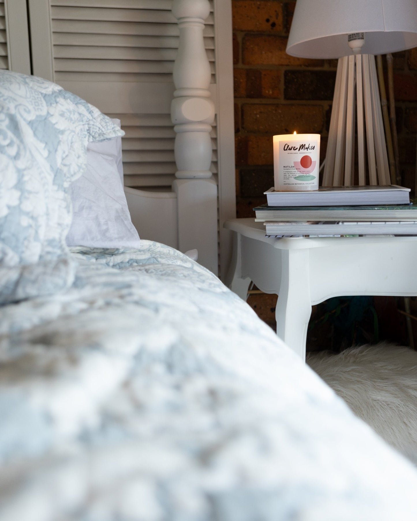 The Clare Makes Matilda candle displayed at home, on a bedside table
