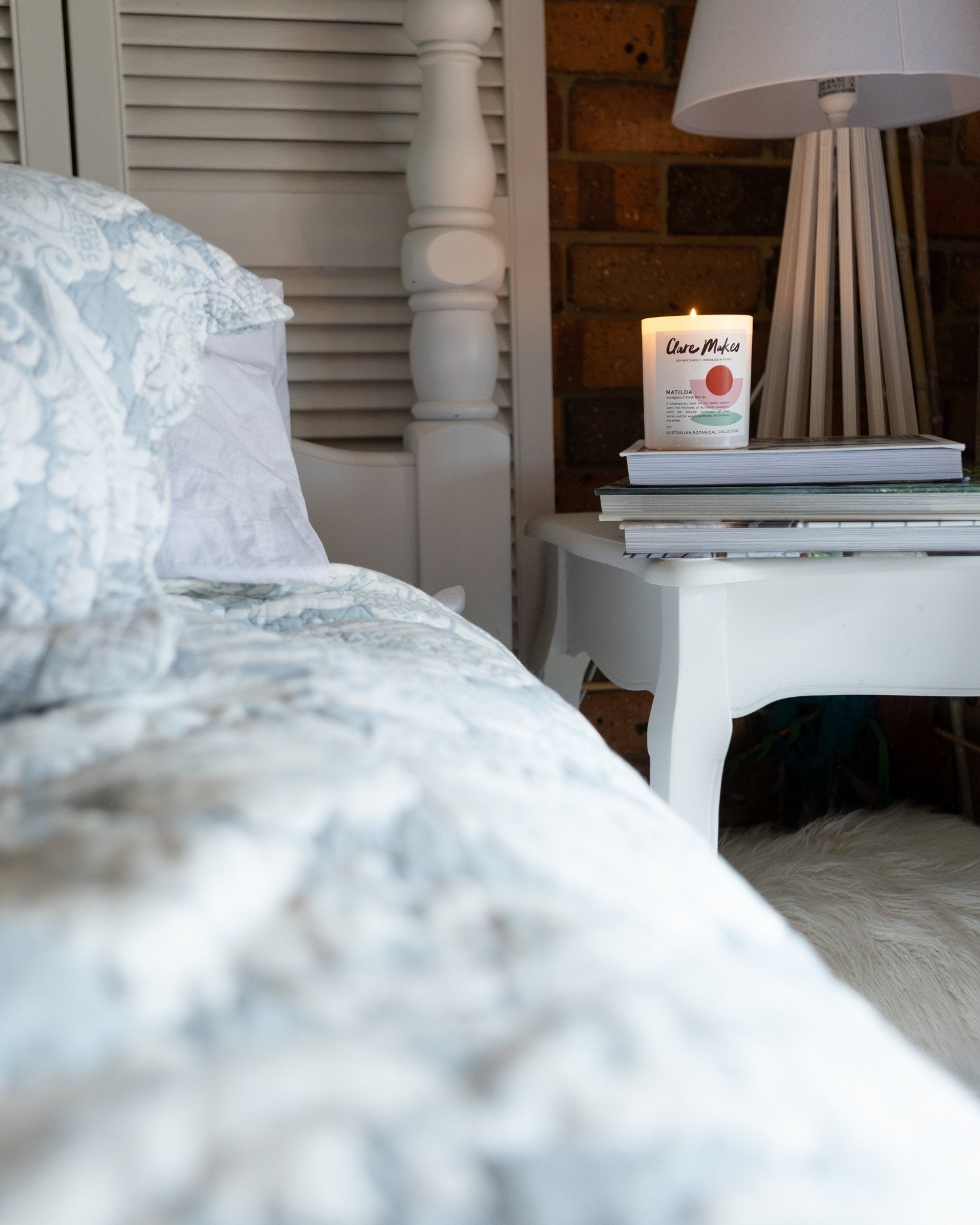 The Clare Makes Matilda candle displayed at home, on a bedside table