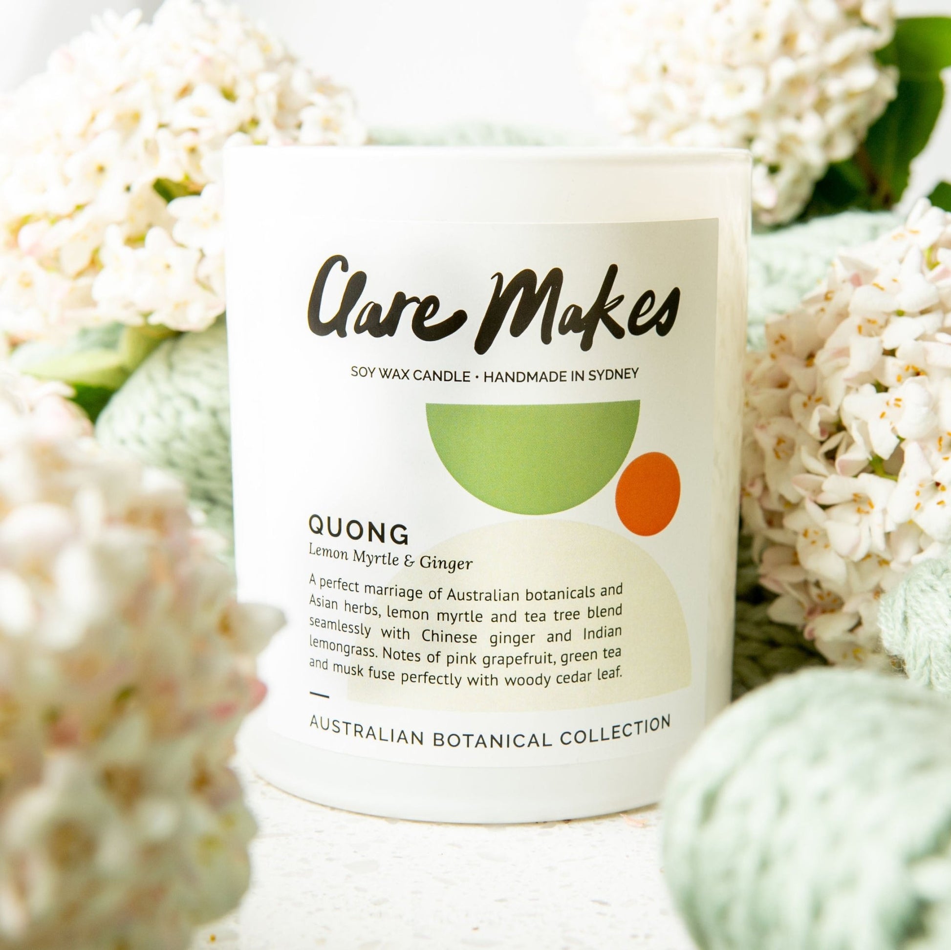 Clare Makes Quong candle in white glass jar labelled Lemon Myrtle & Ginger, part of the Australian Botanical Collection