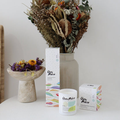 Blue Mountain Air Large Candle 280g - Clare Makes - hand-poured soy wax candle with lemon myrtle, cactus and cedar scent displayed with dried botanicals